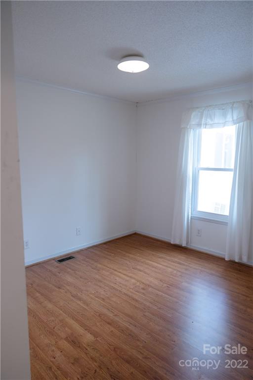5040 Tabernacle Road Lancaster, SC 29720 - Photo 21 of 26 an empty room with wooden floor and windows