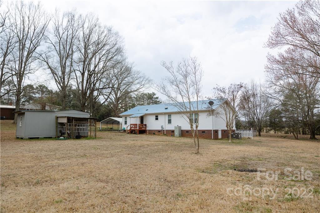 5040 Tabernacle Road Lancaster, SC 29720 - Photo 26 of 26 a view of a house with a large tree in front of a house