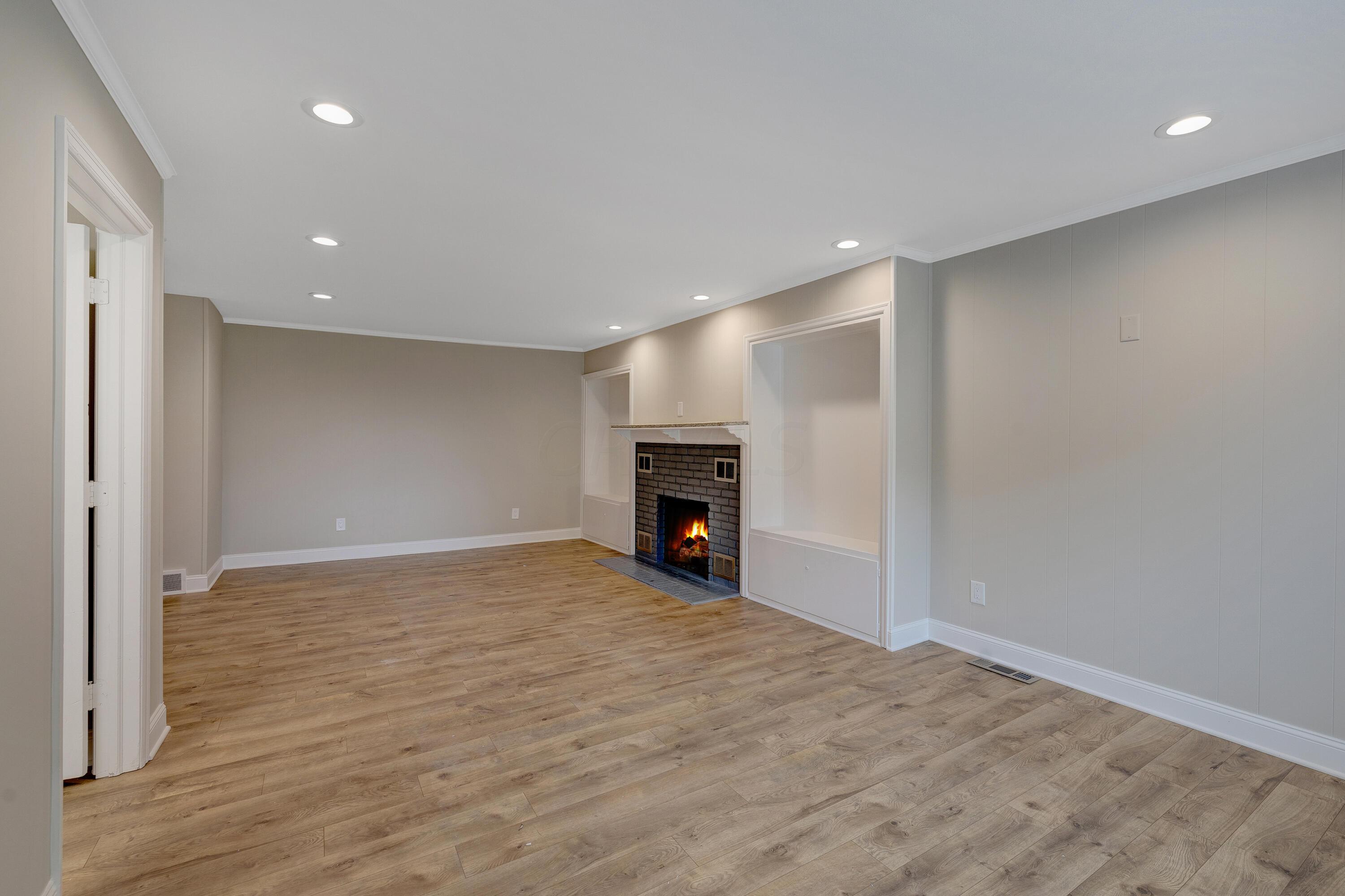 8119 South Old State Road Lewis Center, OH 43035 - Photo 11 of 50 Family room with wood-burning fireplace