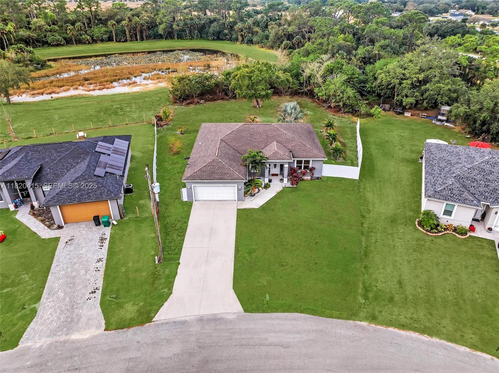 6027 Acorn Circle LaBelle, FL 33935 - Photo 24 of 26 an aerial view of a house with garden space and ocean view