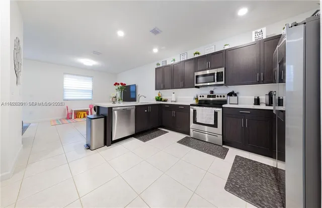 a balcony with furniture and a fireplace