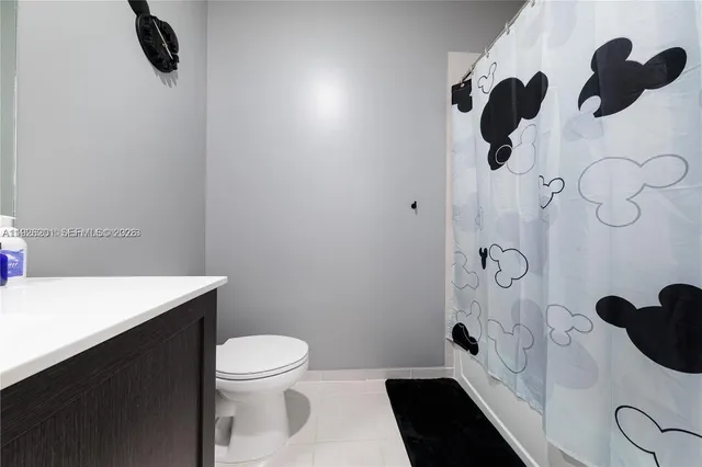 a kitchen with stainless steel appliances a stove a sink and a refrigerator