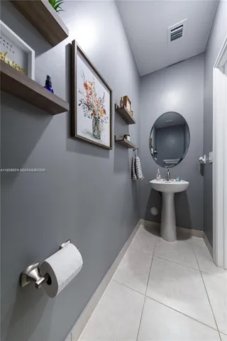 a bathroom with a shower and a sink