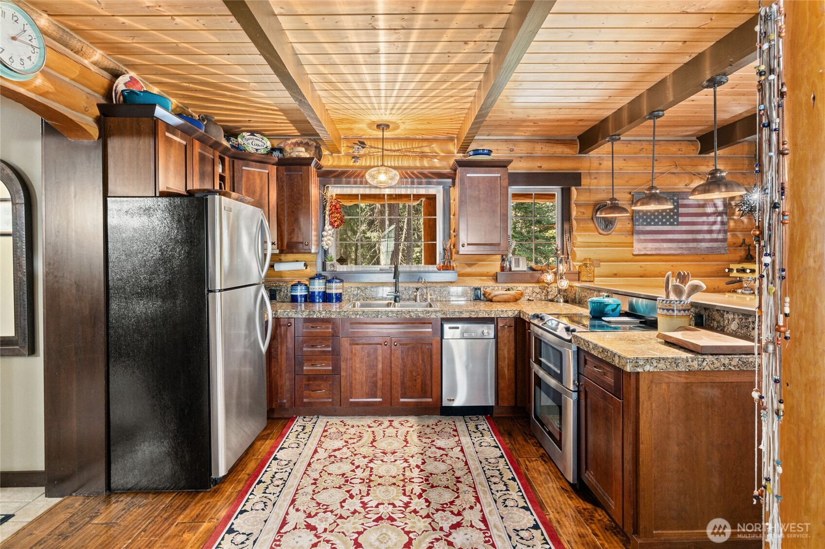 20 Skull Springs Road Cle Elum, WA 98922 - Photo 5 of 35 a kitchen with stainless steel appliances granite countertop a refrigerator a sink a stove and wooden floors