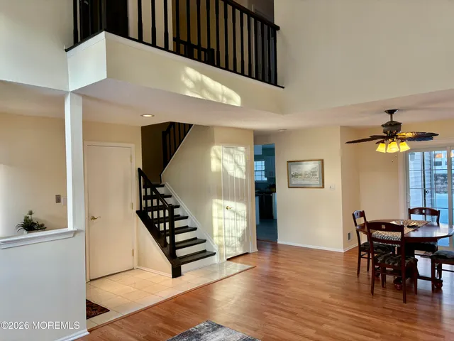 a view of dining room with furniture and wooden floor