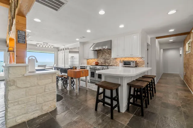 a kitchen with a table and chairs in it