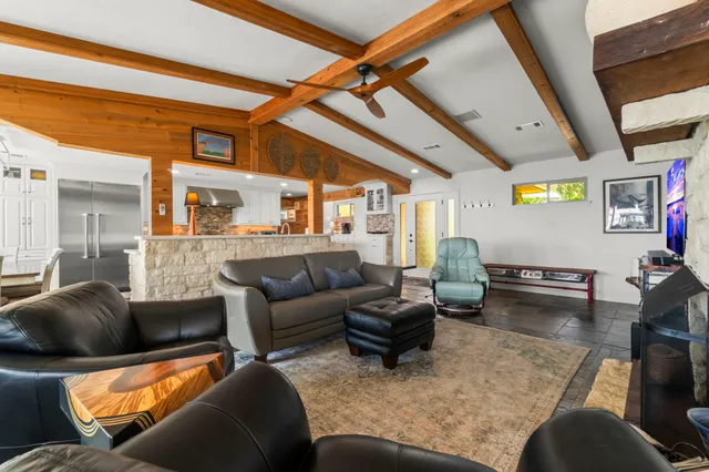 a living room with furniture and a rug