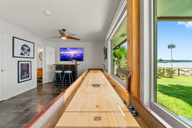 a view of hall way with furniture