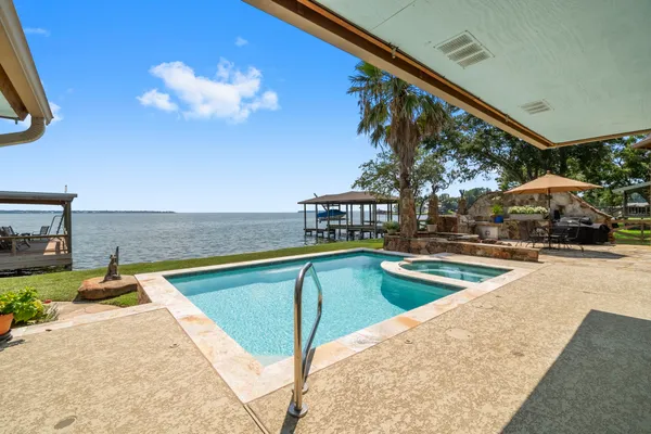 a view of a swimming pool with a lounge chairs