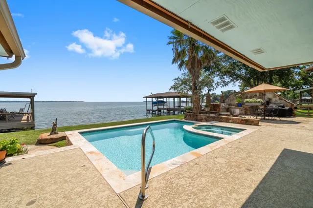 a view of a swimming pool with a lounge chairs