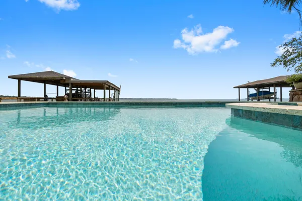 a balcony with a yard and outdoor seating