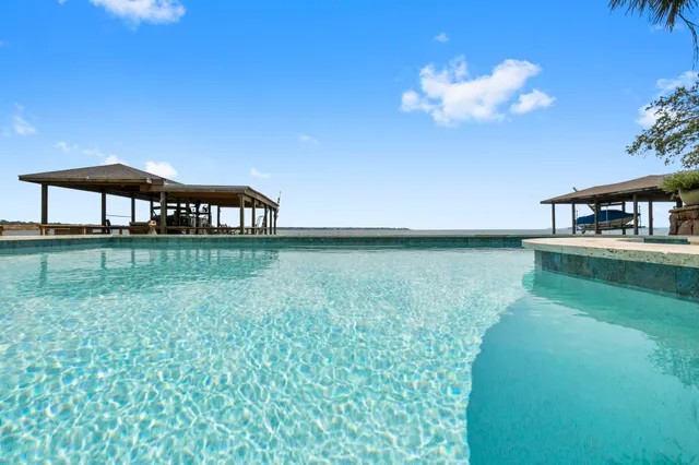 a balcony with a yard and outdoor seating