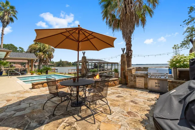 a view of a swimming pool with lounge chairs