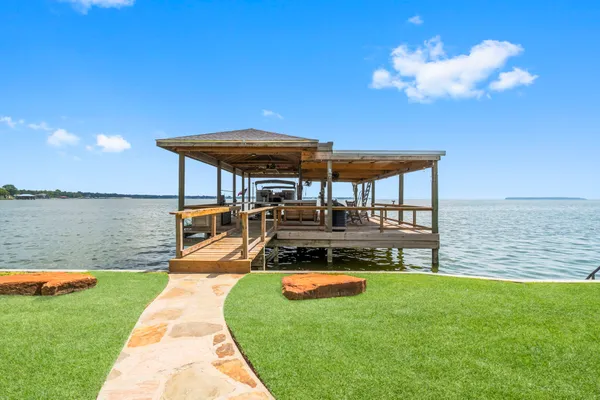 a view of a swimming pool with a yard