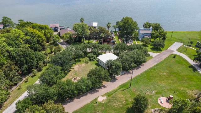 a view of a house with a yard porch and sitting area