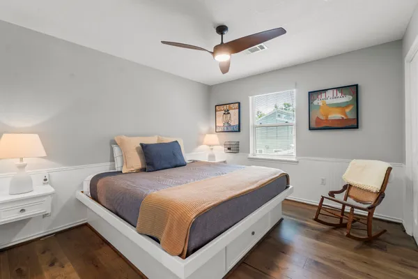 a bedroom with a bed and a table in it