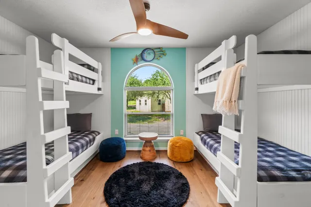 a bedroom with furniture and a fireplace