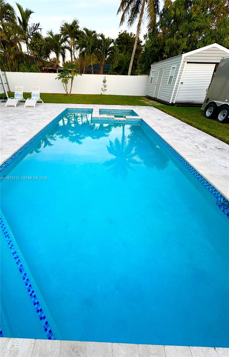 9230 Southwest 68th Street Miami, FL 33173 - Photo 21 of 29 a view of a swimming pool and an outdoor space