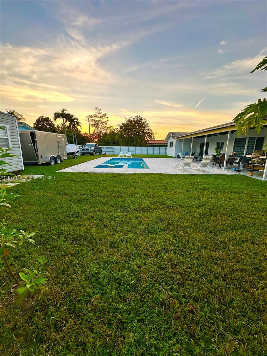 9230 Southwest 68th Street Miami, FL 33173 - Photo 23 of 29 a view of a house with a big yard and large trees