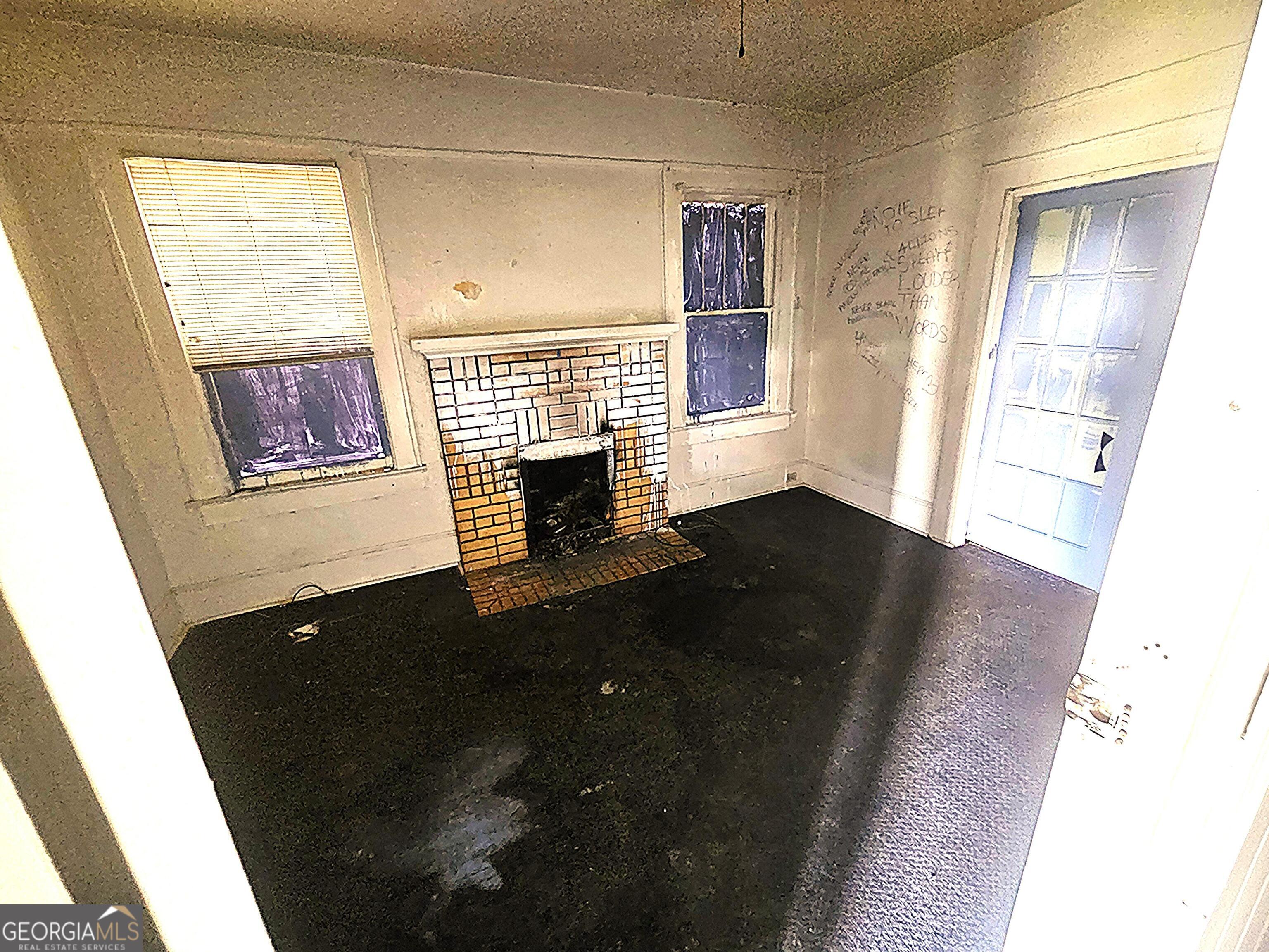 604 Hicks Street Waycross, GA 31501 - Photo 10 of 10 a view of empty room with wooden floor and fan