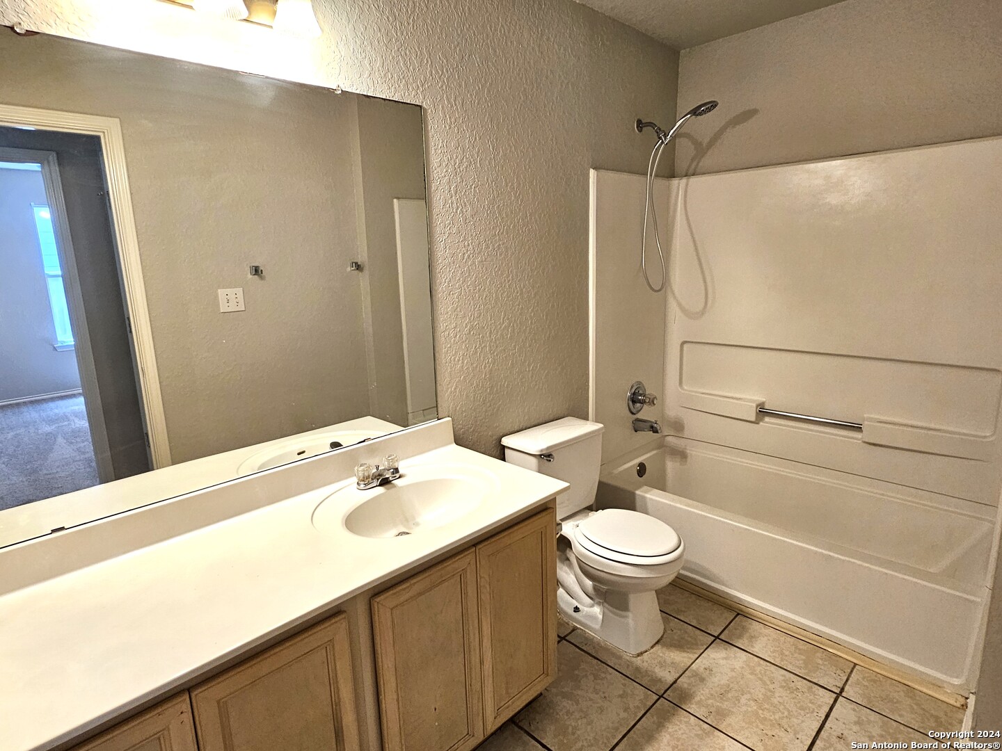 3321 Whisper Bluff Schertz, TX 78108 - Photo 14 of 17 a bathroom with a sink a toilet and shower