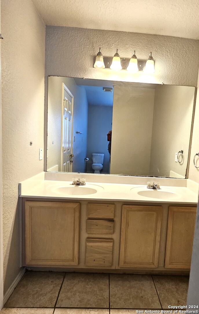 3321 Whisper Bluff Schertz, TX 78108 - Photo 16 of 17 a bathroom with a sink and a mirror