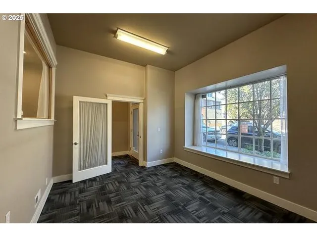 a view of an empty room with a window