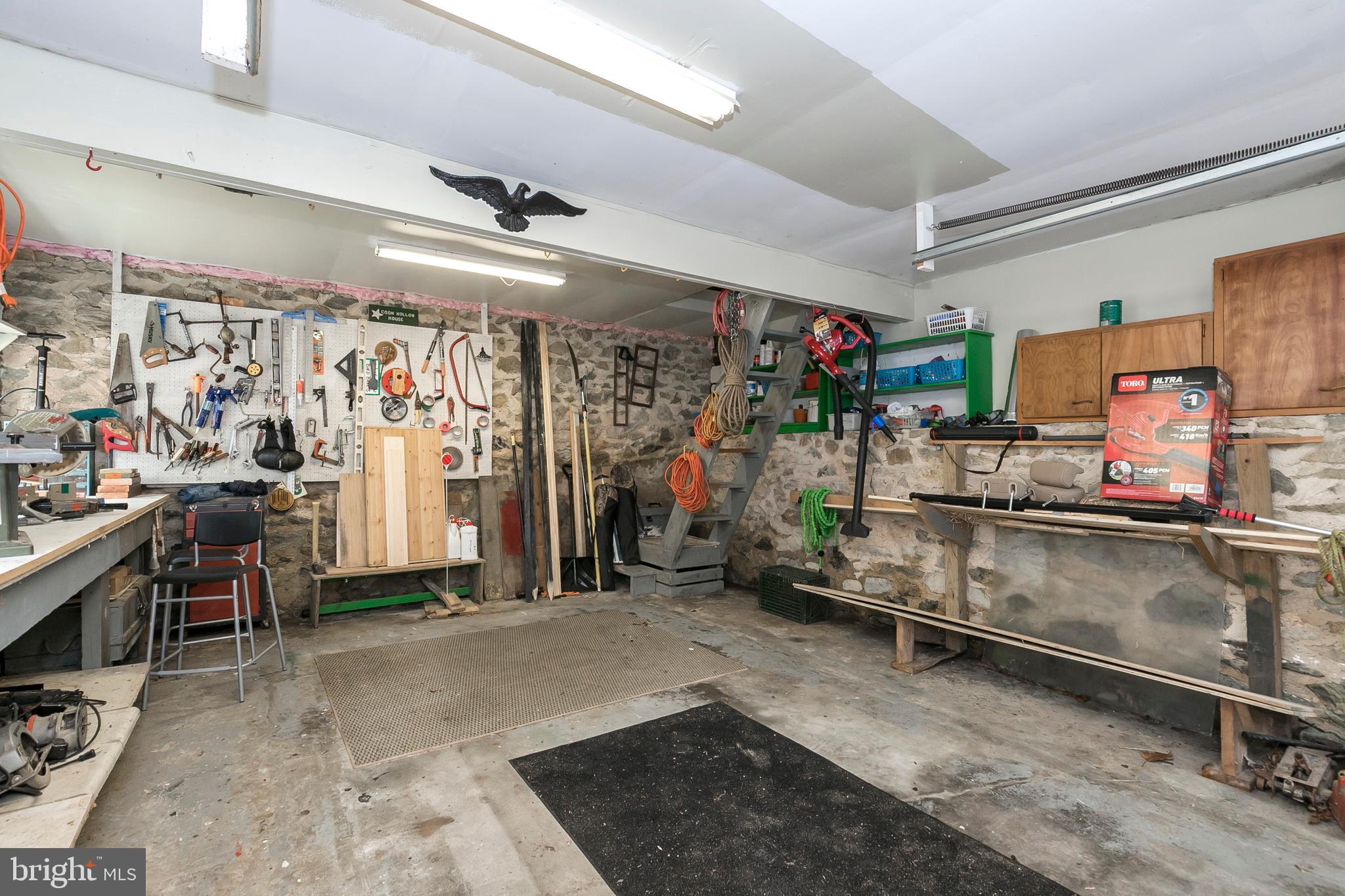 340 Norwood Road Downingtown, PA 19335 - Photo 32 of 36 Ample garage, work space and storage above.