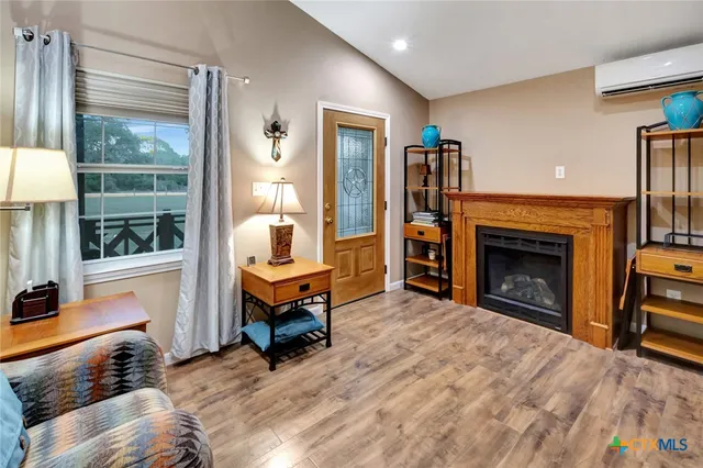 a bedroom with furniture and a lamp