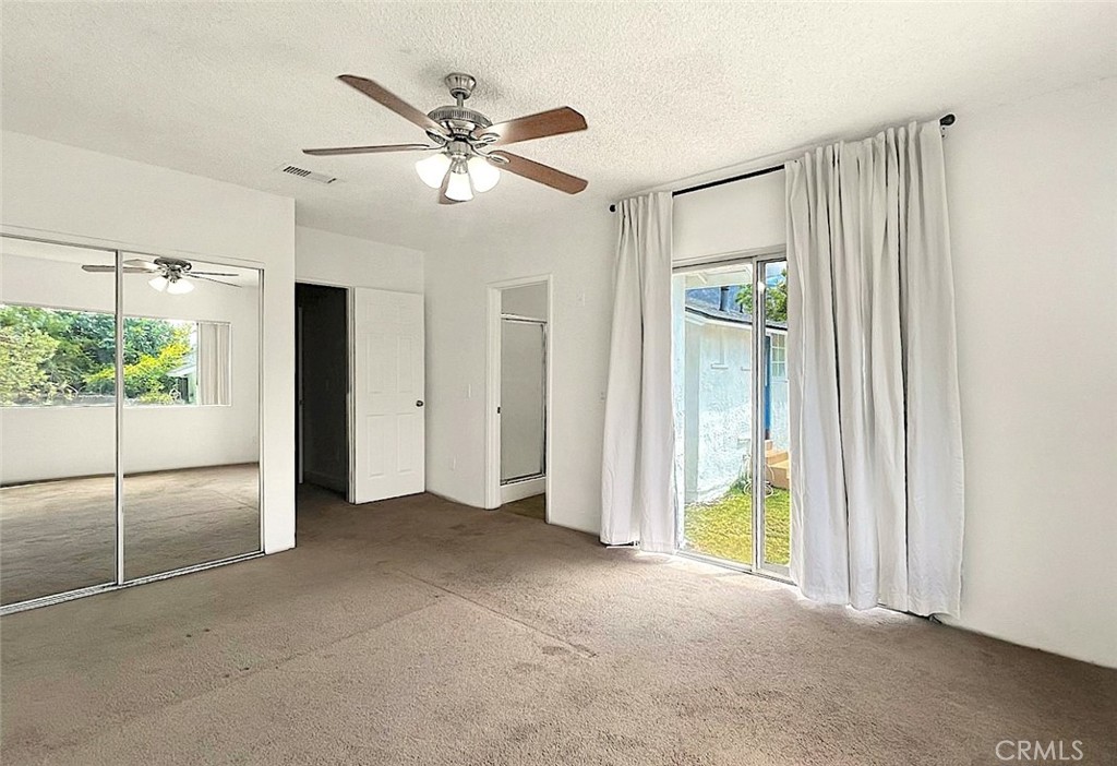 1554 East Woodbury Road Pasadena, CA 91104 - Photo 12 of 13 a view of an empty room with a window