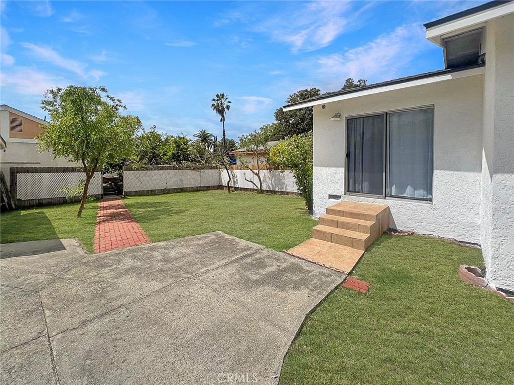 1554 East Woodbury Road Pasadena, CA 91104 - Photo 13 of 13 a view of a backyard with a garden and trees