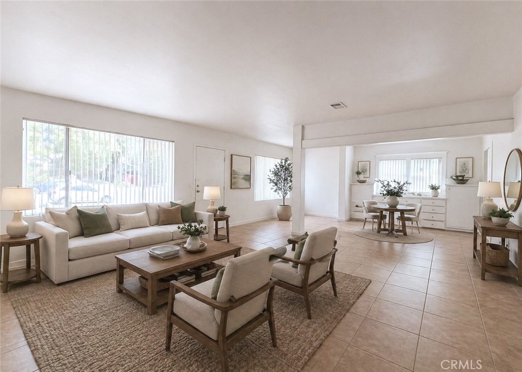 1554 East Woodbury Road Pasadena, CA 91104 - Photo 4 of 13 a living room with furniture and a large window