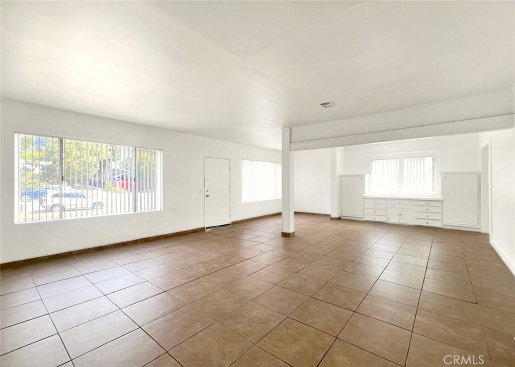 1554 East Woodbury Road Pasadena, CA 91104 - Photo 5 of 13 a view of an empty room with a window