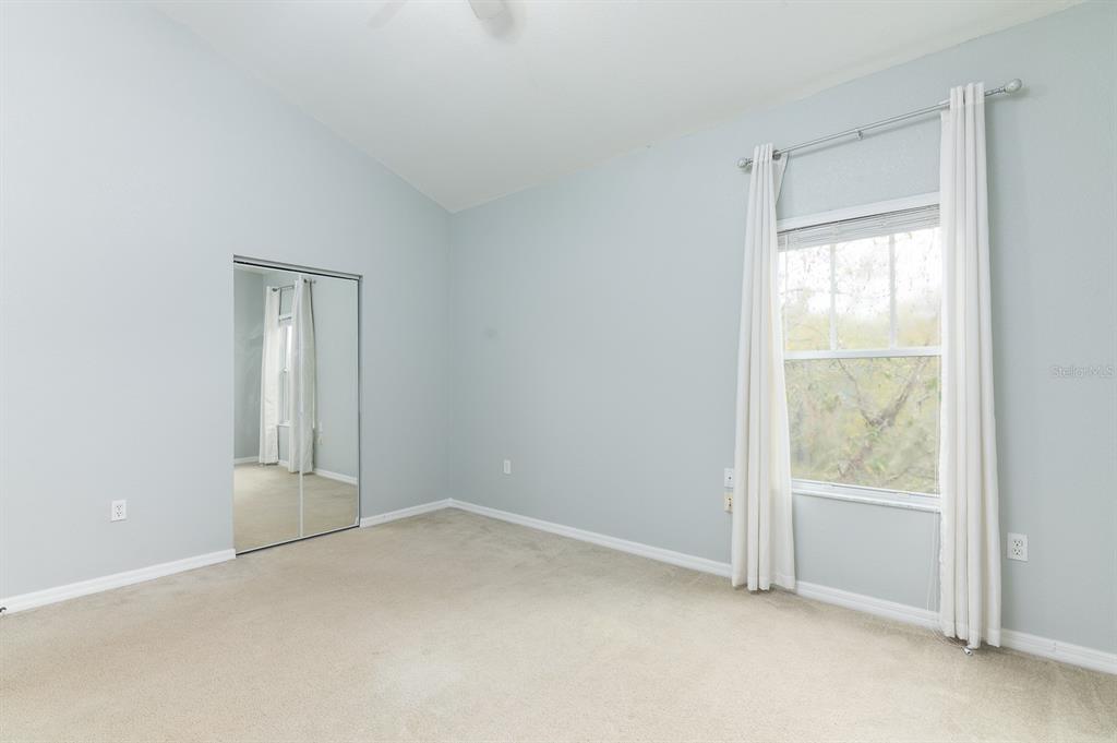 4850 Southwest 91 Terrace, Unit 301 Gainesville, FL 32608 - Photo 15 of 24 a view of an empty room with a window