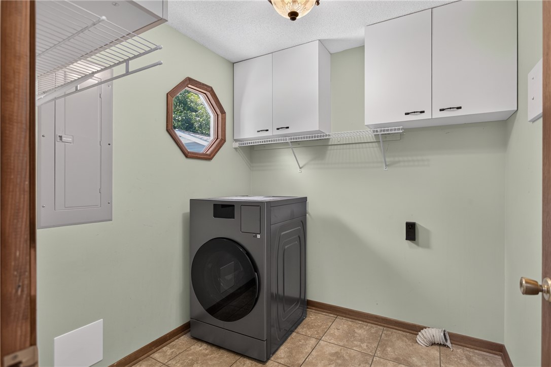 103 Dorsey Lane Walhalla, SC 29691 - Photo 11 of 42 Functional utility room with ample storage and a unique octagonal window, perfect for everyday chores.