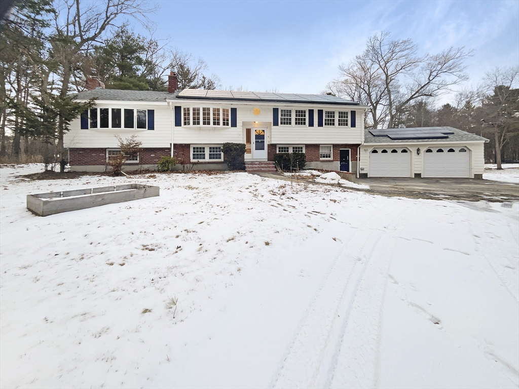 16 Marlyn Road Billerica, MA 01821 - Photo 1 of 34 a front view of a house with a yard covered in snow