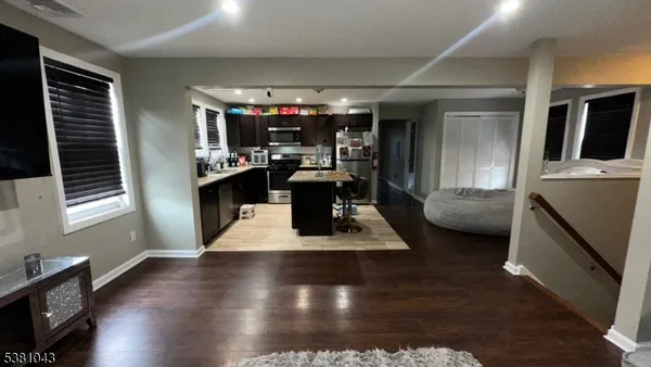 a view of living room with furniture and a window