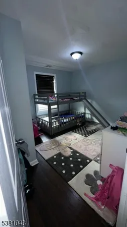 a room with furniture pool table and flat screen tv