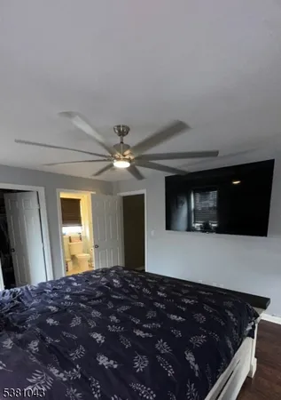 a bedroom with bed and a window