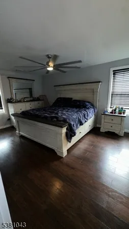 a bedroom with bed and window