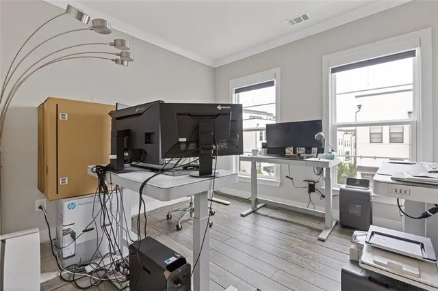 a bathroom with a granite countertop sink toilet and mirror