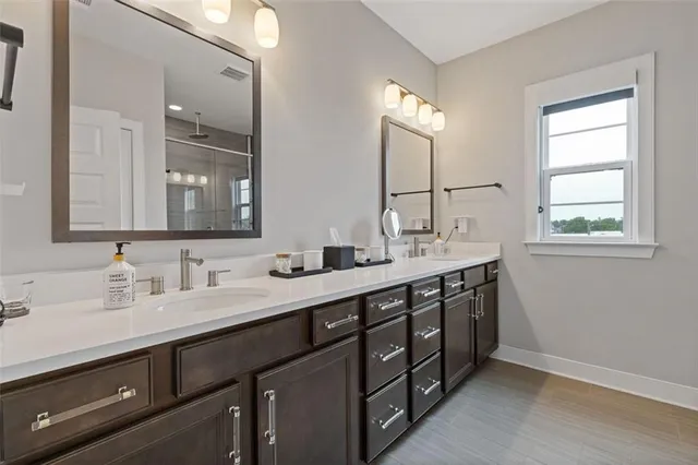 a bathroom with a glass shower door