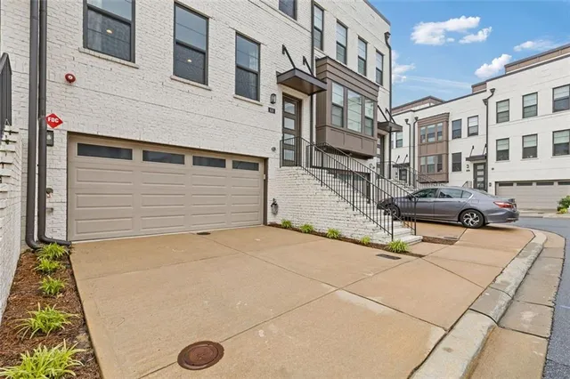 a view of a street with tall buildings
