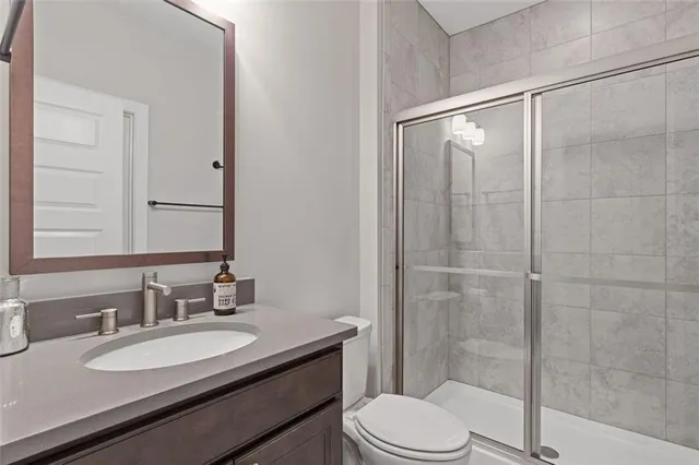 a bathroom with a shower and a sink