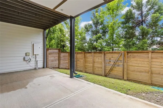a front view of multi story residential apartment building with a yard