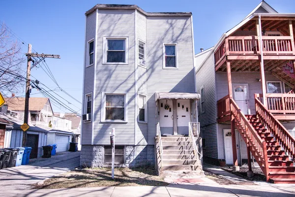 a front view of a building with a street
