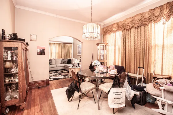 a view of a livingroom with furniture window and wooden floor