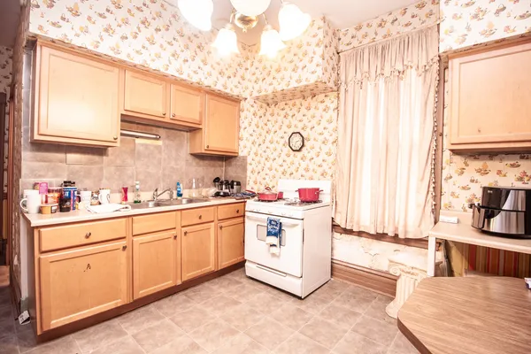 a kitchen with a sink and cabinets