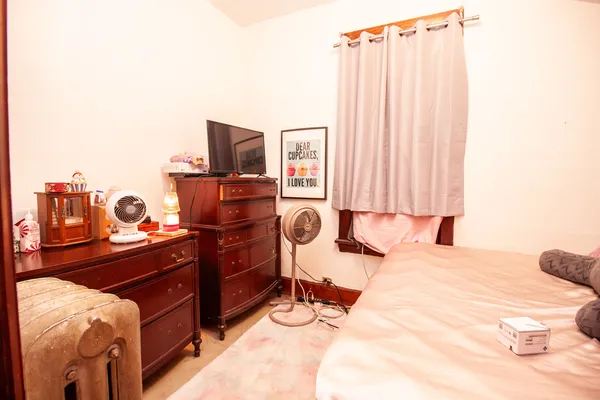 a bedroom with a bed and furniture