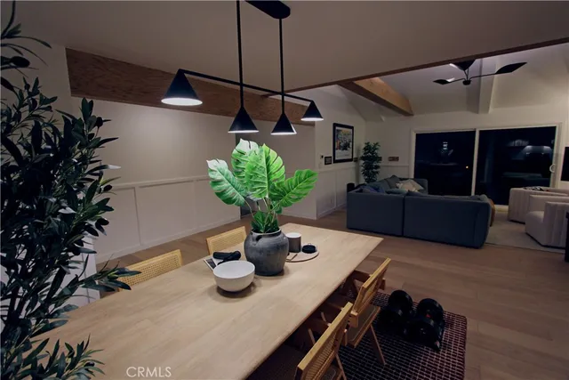 a living room with furniture and a lamp